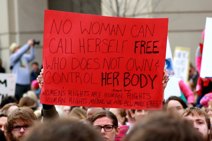 Sign at Women's March reads, " No woman can call herself free who does not own control her body. Women's rights are human rights. Human rights means we are all more free!"