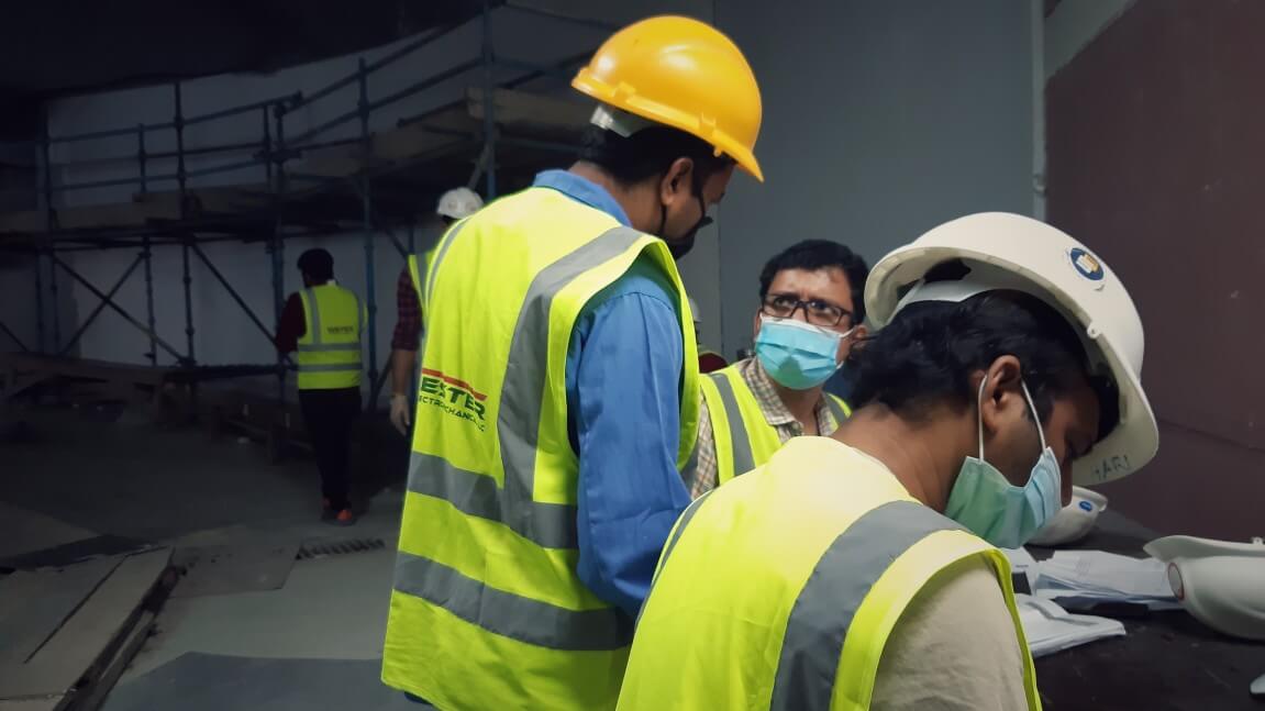 Masked construction workers