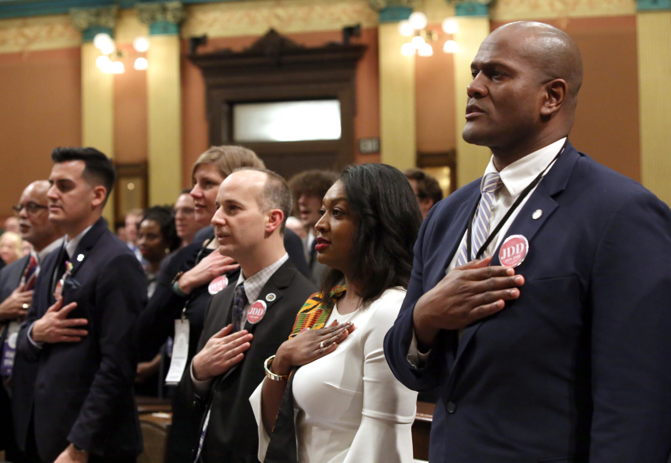 A diverse crowd of state legislators take oath