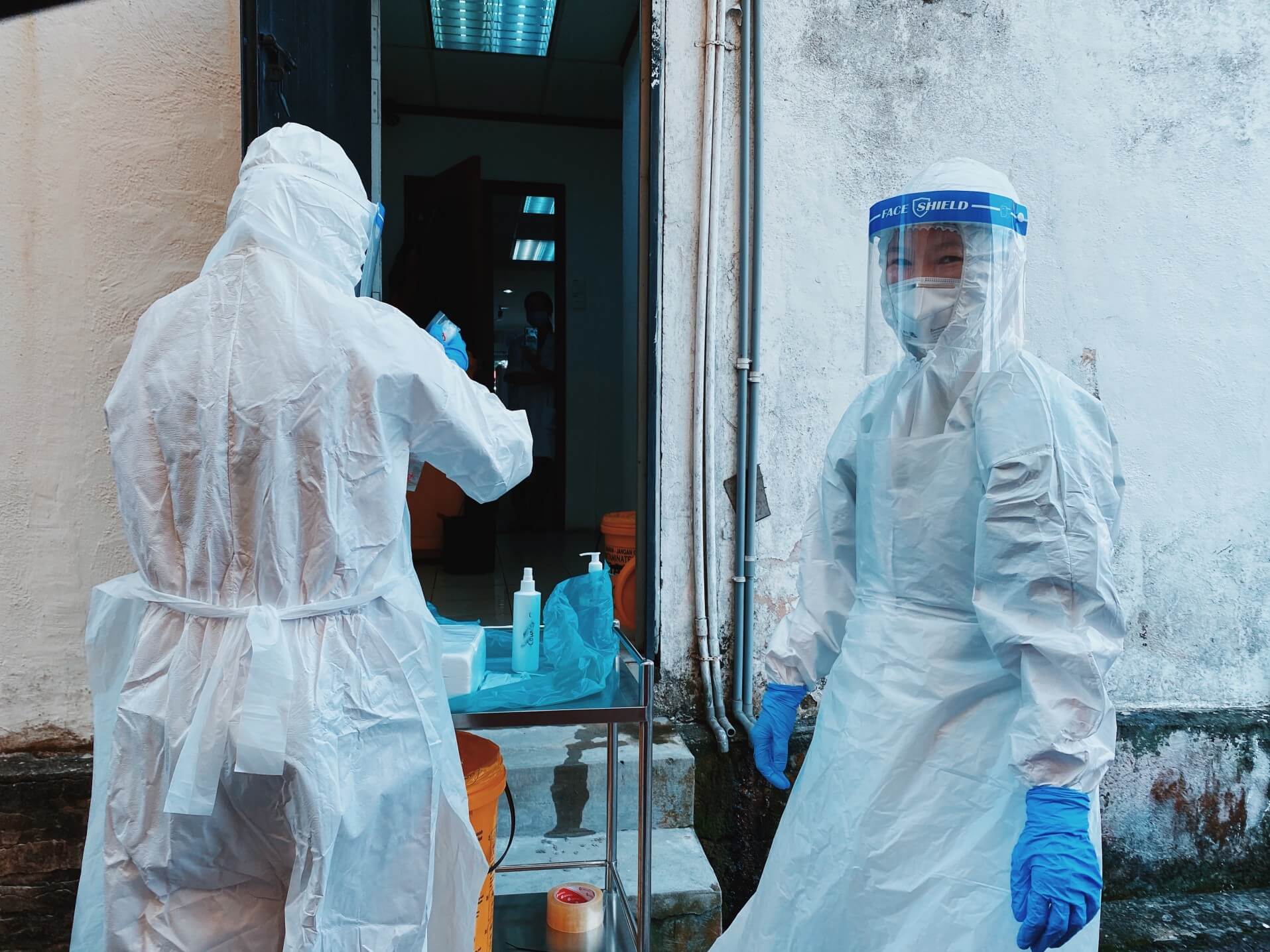 Healthcare workers in full PPE (personal protective equipment)