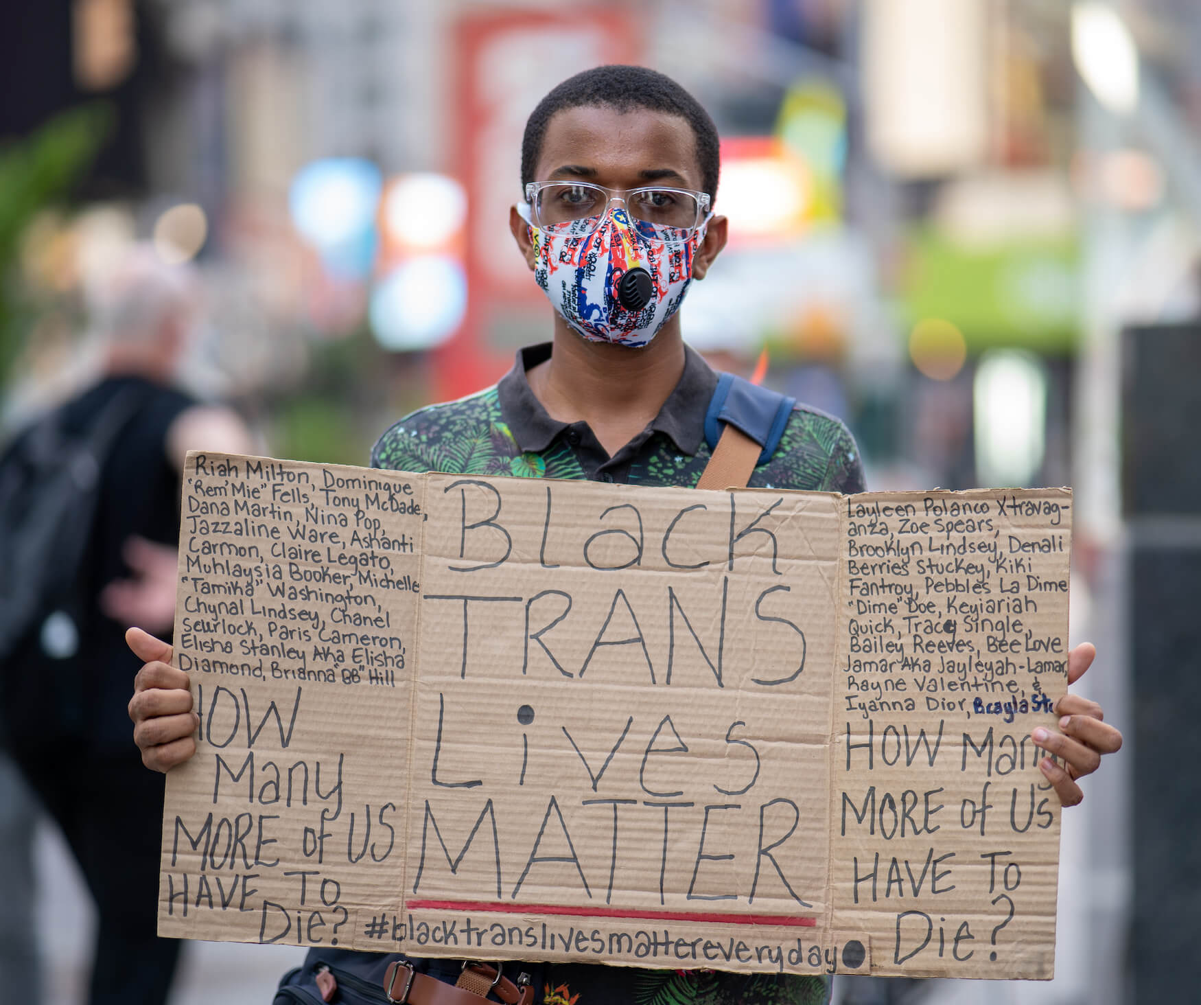 Demonstrator holding "Black Trans Lives Matter" sign