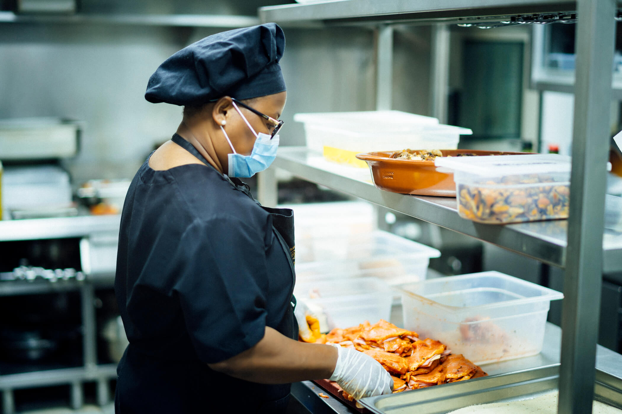 Black chef preparing food for those most in need during the economic crisis