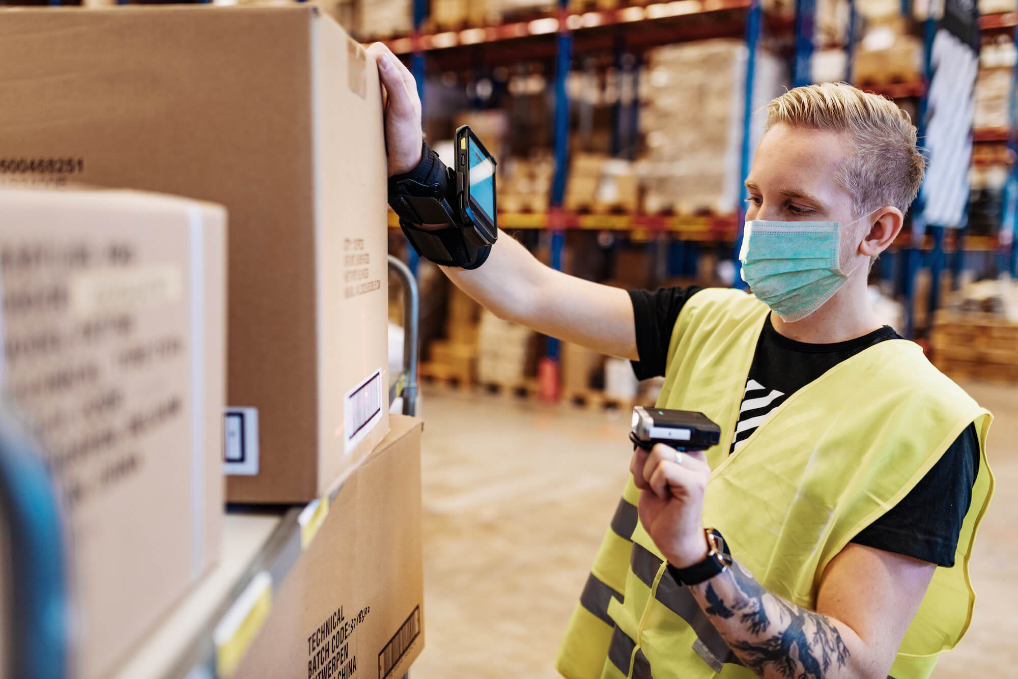 Tattooed white essential workers in service and delivery industry with face mask during covid pandemic